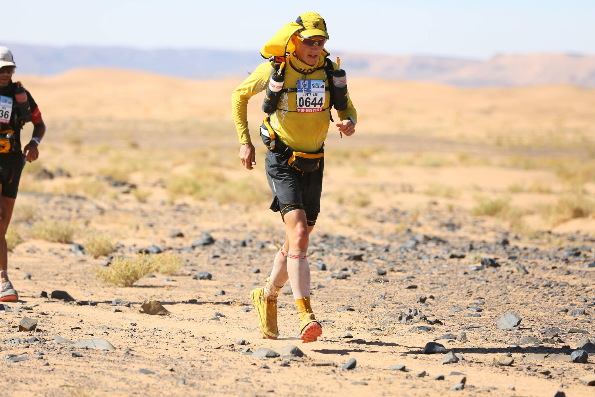 SLS3 compression socks and calf sleeves worn by a runner